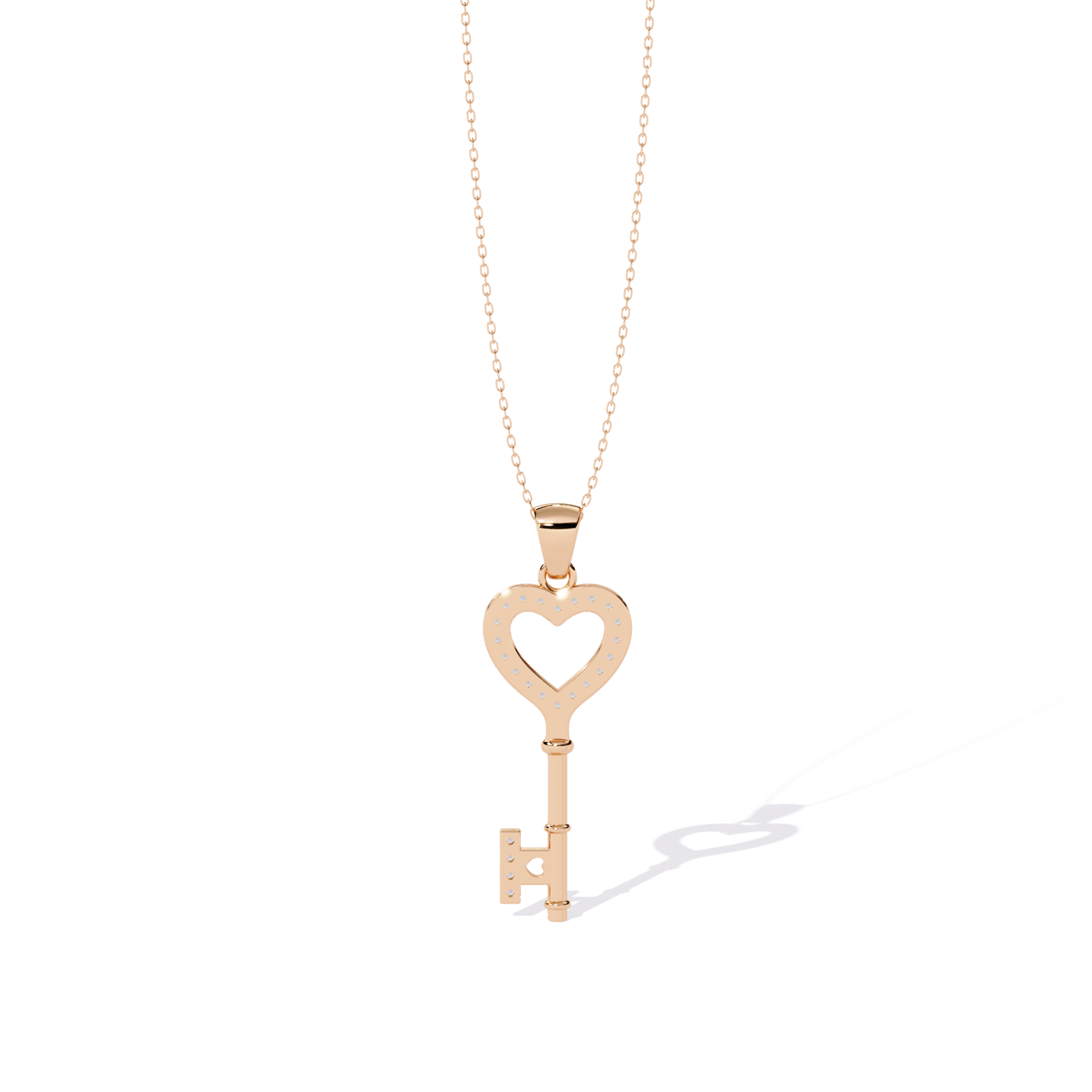 Rose gold open heart key pendant rear view featuring open heart back cutout, dotted diamond seat holes, smooth metal back, and straight key rear design