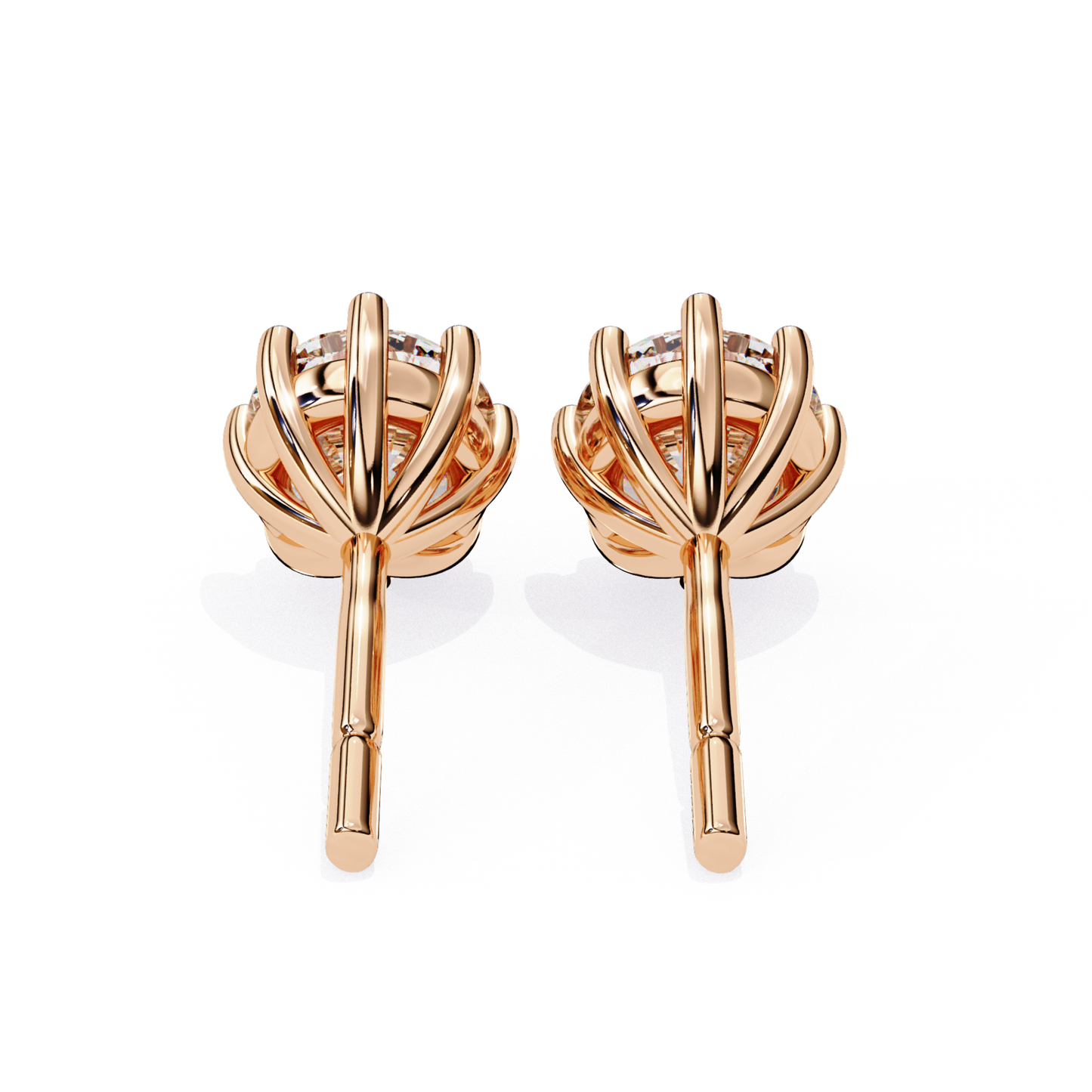 Rose gold earrings with a floral design on a white background