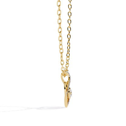 yellow gold heart pendant showing slim profile with layered diamond curve and raised round center stone