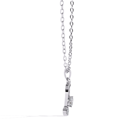 White gold musical note pendant featuring a heart element and detailed stone setting