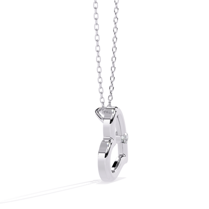 Side view of an open heart pendant in white gold with a single round diamond accent