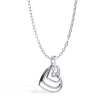 White gold open heart pendant featuring a nested open heart design with a hanging round diamond