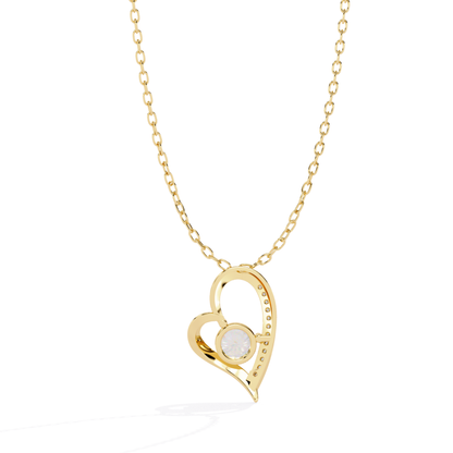 Gold heart-shaped with a small round diamond on a white background
