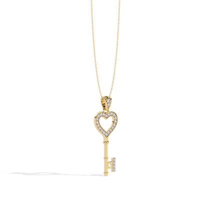Yellow gold open heart key diamond pendant with heart-shaped open center outlined in diamonds, straight polished key stem, and diamond-accented key bit